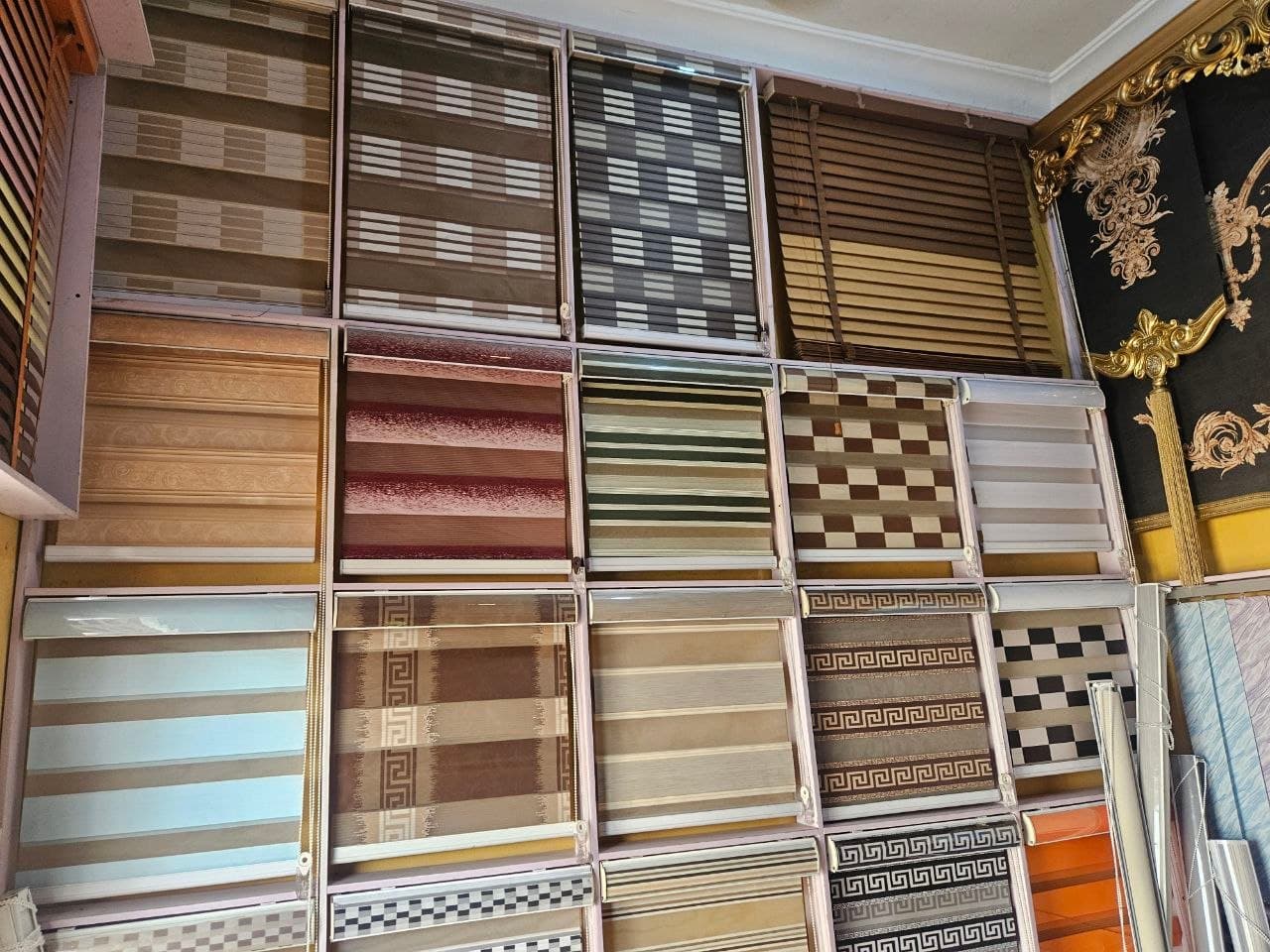 Wooden venetian and patterned day & night blinds on display at the Bosun Blinds showroom